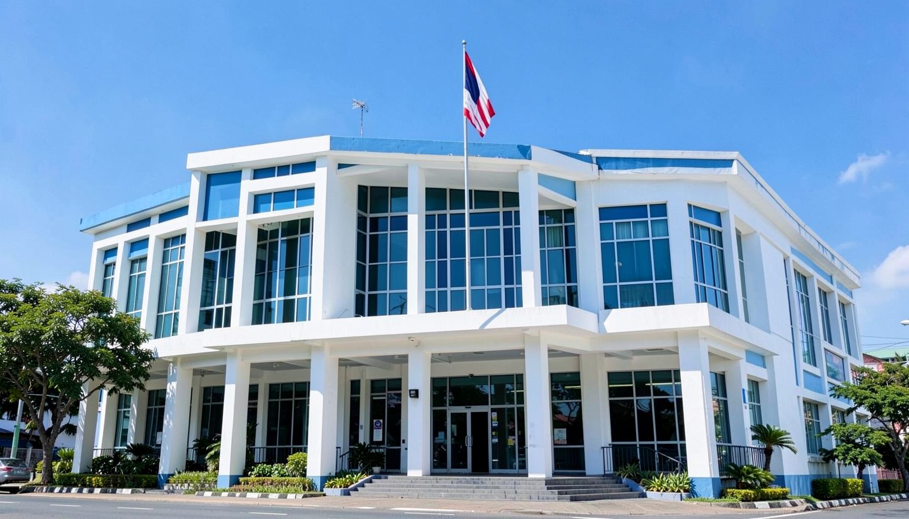 Sunlit government building facade with Philippine flag, clean and orderly civic atmosphere in blue and white tones